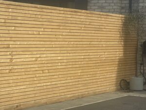Before horizontal Japanese style slat fencing in Knowsley
