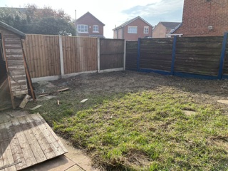 Old garden boundary fence before replacement in Moreton